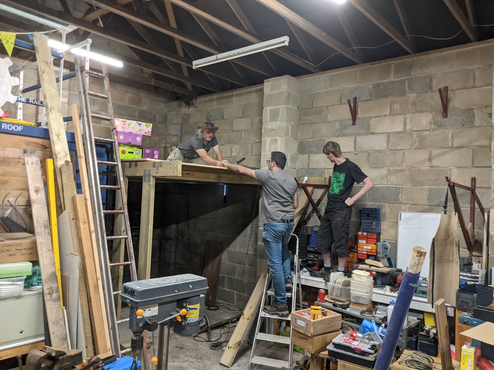 The Makerspace's Mezzanine being built, fitting the OSB floor.